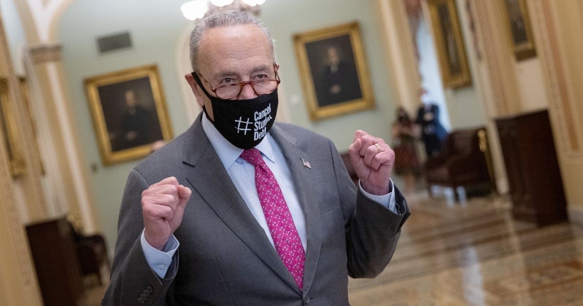 Senate Majority Leader Chuck Schumer emerges from the Senate chamber at the U.S. Capitol on Tuesday in Washington, D.C.