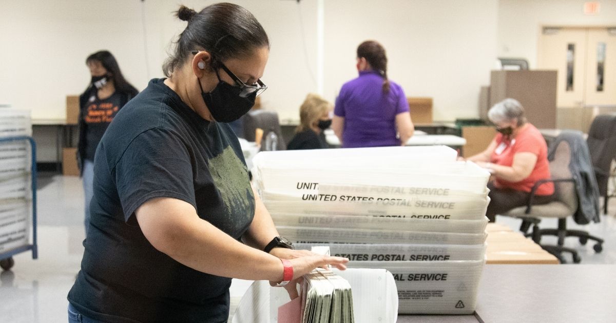 A Maricopa County Elections Department staff member counts ballots on Oct. 31, 2020 in Phoenix, Arizona.
