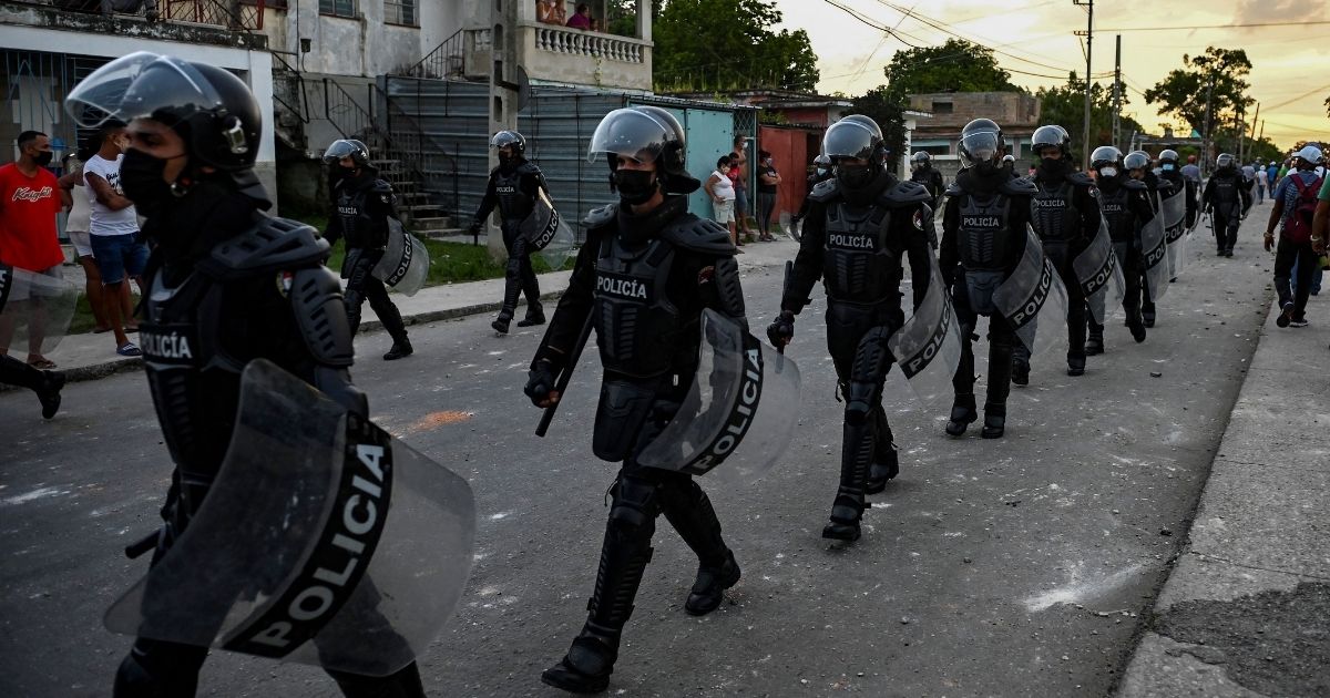 Riot police walk the streets after a demonstration against the government of President Miguel Díaz-Canel in Havana on July 12, 2021.