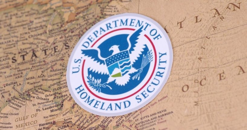The seal of the Department of Homeland Security is pictured on a map in the stock image above.