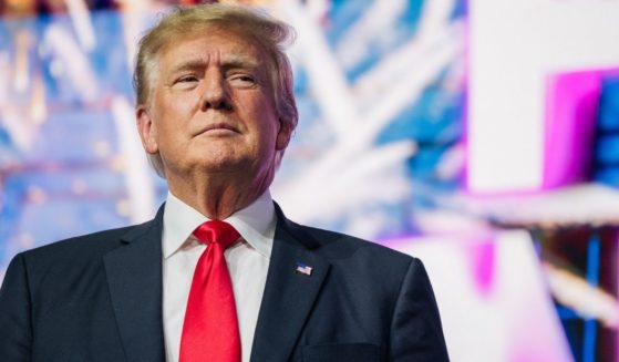Former President Donald Trump makes an entrance at the Rally to Protect Our Elections conference on July 24, 2021, in Phoenix.