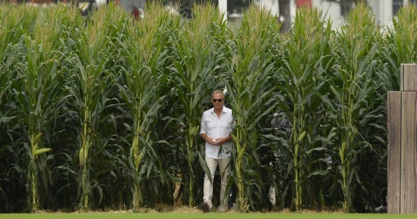 Actor Kevin Costner walks through the corn rows while being introduced prior to the game between the Chicago White Sox and New York Yankees on Thursday at the Field of Dreams in Dyersville, Iowa.