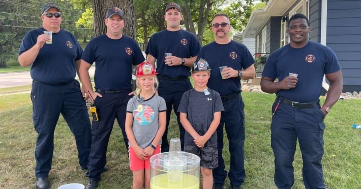 Firefighters visit a lemonade stand in Iowa after a stranger stole the tip jar from the kids running it.