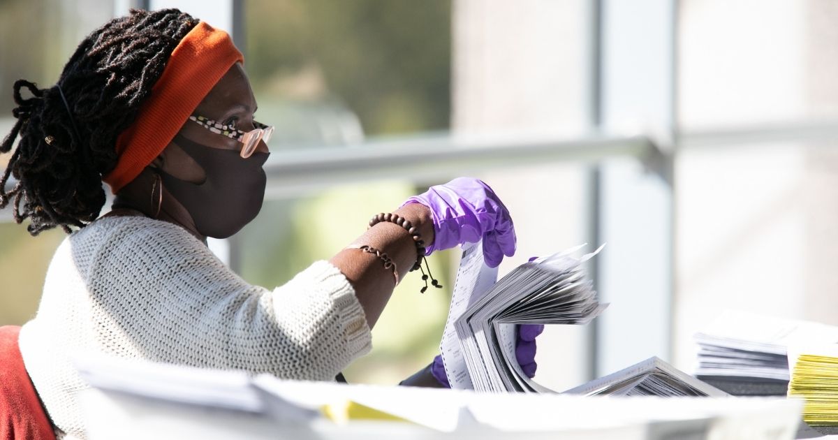 A Fulton County, Georgia, election worker counts ballots at State Farm Arena in Atlanta on Nov. 4, 2020.