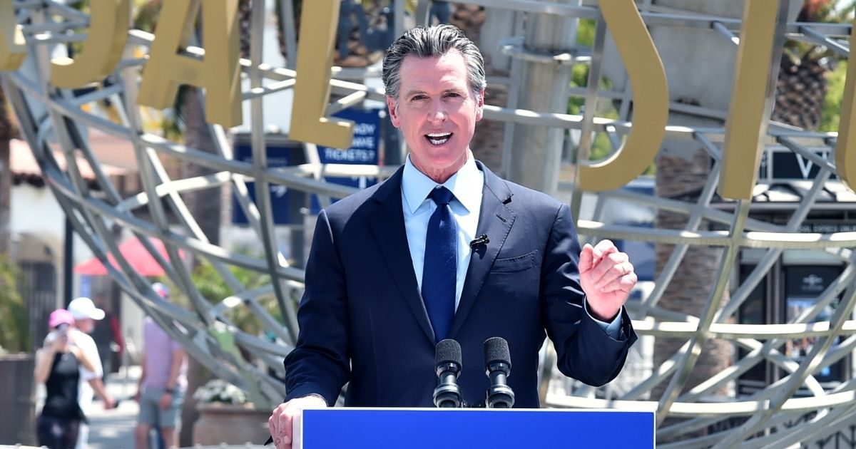 Democratic California Gov. Gavin Newsom attends a news conference for the official reopening of the state of California at Universal Studios Hollywood on June 15, 2021, in Universal City, California.
