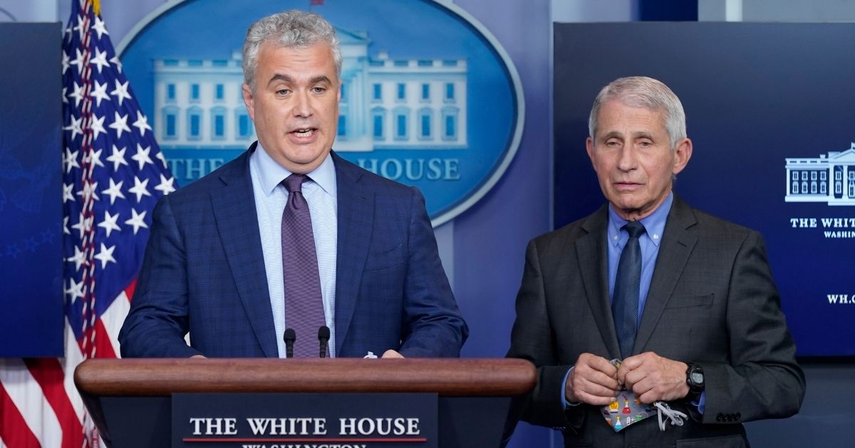 White House COVID-19 Response Coordinator Jeff Zients, left, speaks alongside Dr. Anthony Fauci, director of the National Institute of Allergy and Infectious Diseases, during a media briefing at the White House on April 13, 2021, in Washington, D.C.