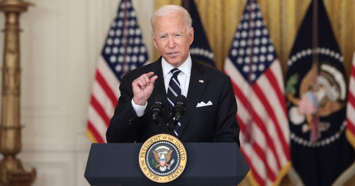 President Joe Biden gestures as he delivers remarks on the COVID-19 response and the vaccination program in the East Room of the White House on Wednesday in Washington, D.C.