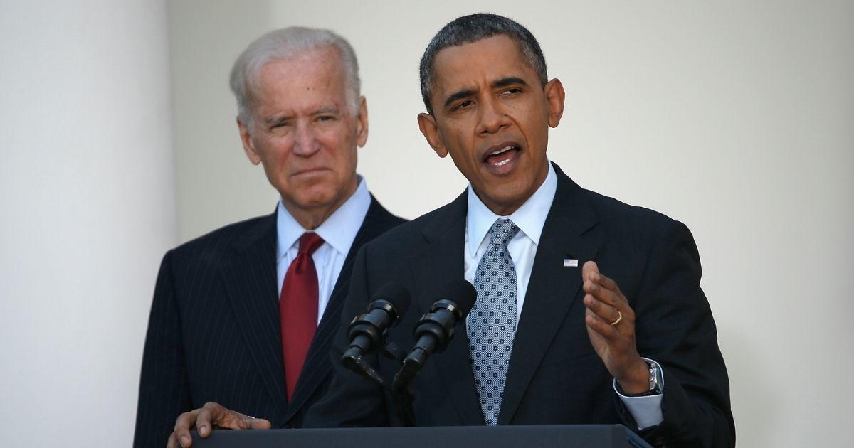 Then-President Barack Obama speaks with then-Vice President Joe Biden in the Rose Garden of the White House on April 1, 2014, in Washington, D.C.