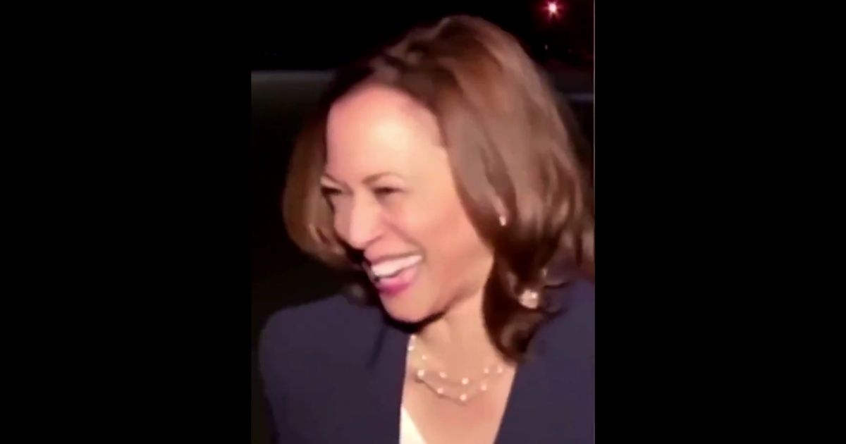 Vice President Kamala Harris laughs as reporters ask her about Afghanistan on Friday.