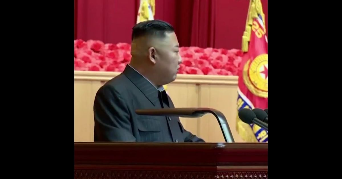 North Korea Supreme Leader Kim Jong Un is seen speaking at a late July event, with a bandage on the back of his head.