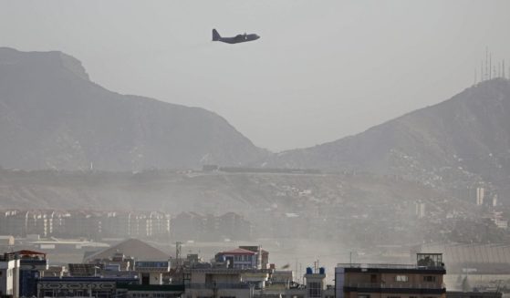 A military aircraft takes off from the military airport in Kabul, Afghanistan, on Friday.
