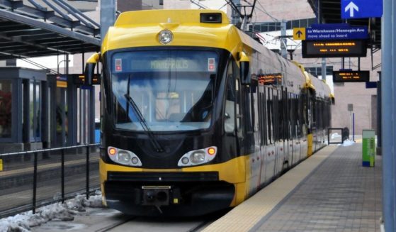 This stock image shows a metro train approaching a stop in Minneapolis. Jewlese Maxine Floyd, 20, allegedly stabbed a man at a light rail station, before being released and again stabbing a woman at a St. Paul, Minnesota, hospital.