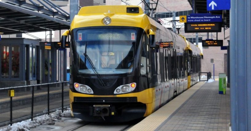 This stock image shows a metro train approaching a stop in Minneapolis. Jewlese Maxine Floyd, 20, allegedly stabbed a man at a light rail station, before being released and again stabbing a woman at a St. Paul, Minnesota, hospital.