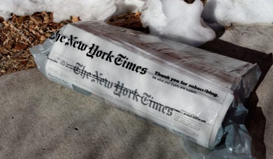 A home-delivered copy of The New York Times is seen on a driveway in Santa Fe, New Mexico.