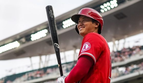 Shohei Ohtani of the Los Angeles Angels smiles during a game against the Minnesota Twins at Target Field in Minneapolis on July 22.