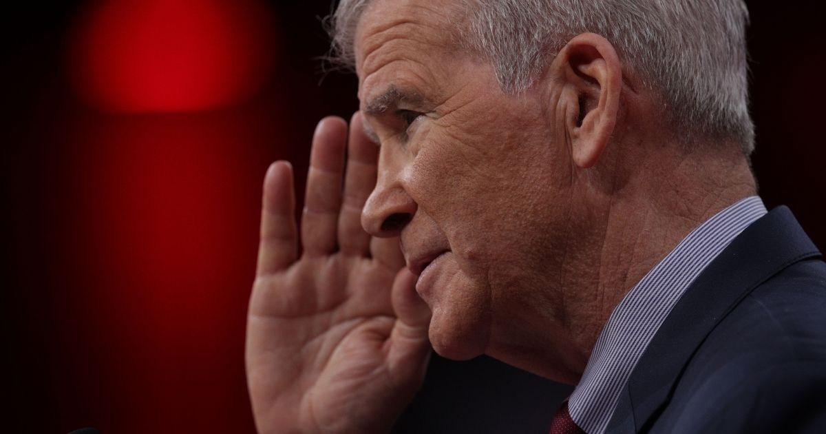 Then-NRA President Oliver North salutes at CPAC 2019 on Feb. 28, 2019, in National Harbor, Maryland.