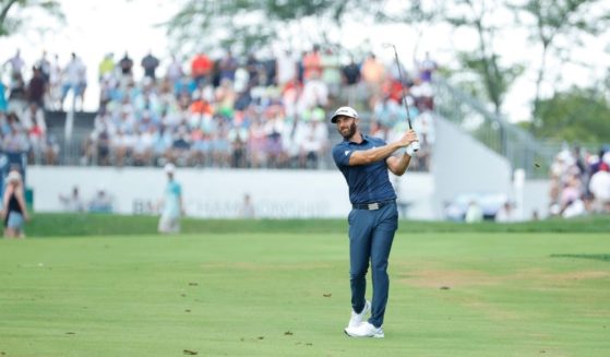 Dustin Johnson of the United States plays his second shot on the 18th hole during the final round of the BMW Championship at Caves Valley Golf Club on Sunday in Owings Mills, Maryland.