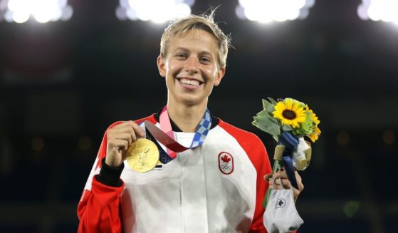 Quinn of Canada poses with a gold medal at the Tokyo Olympic Games at International Stadium on Friday in Yokohama, Japan.