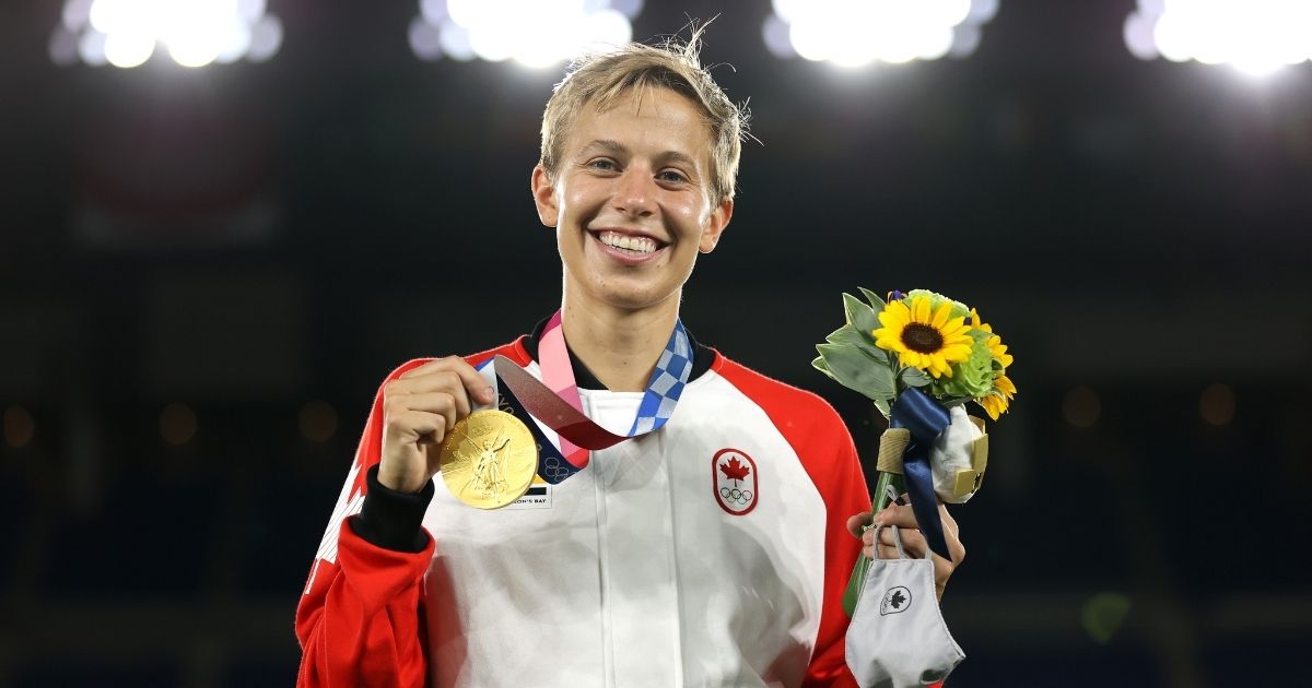 Quinn of Canada poses with a gold medal at the Tokyo Olympic Games at International Stadium on Friday in Yokohama, Japan.