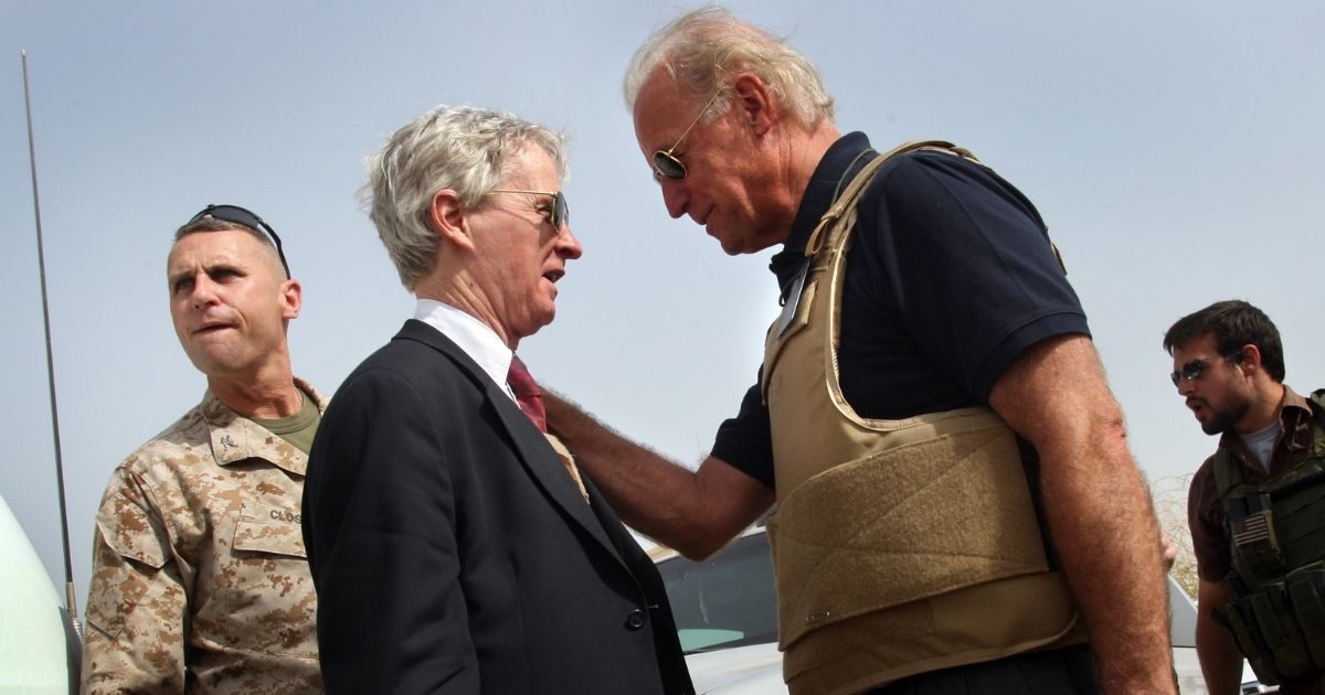 Then-Sen. Joe Biden speaks with Ryan Crocker, then the American ambassador to Iraq, during a visit to Ramadi, Iraq, on Sept. 6, 2007.