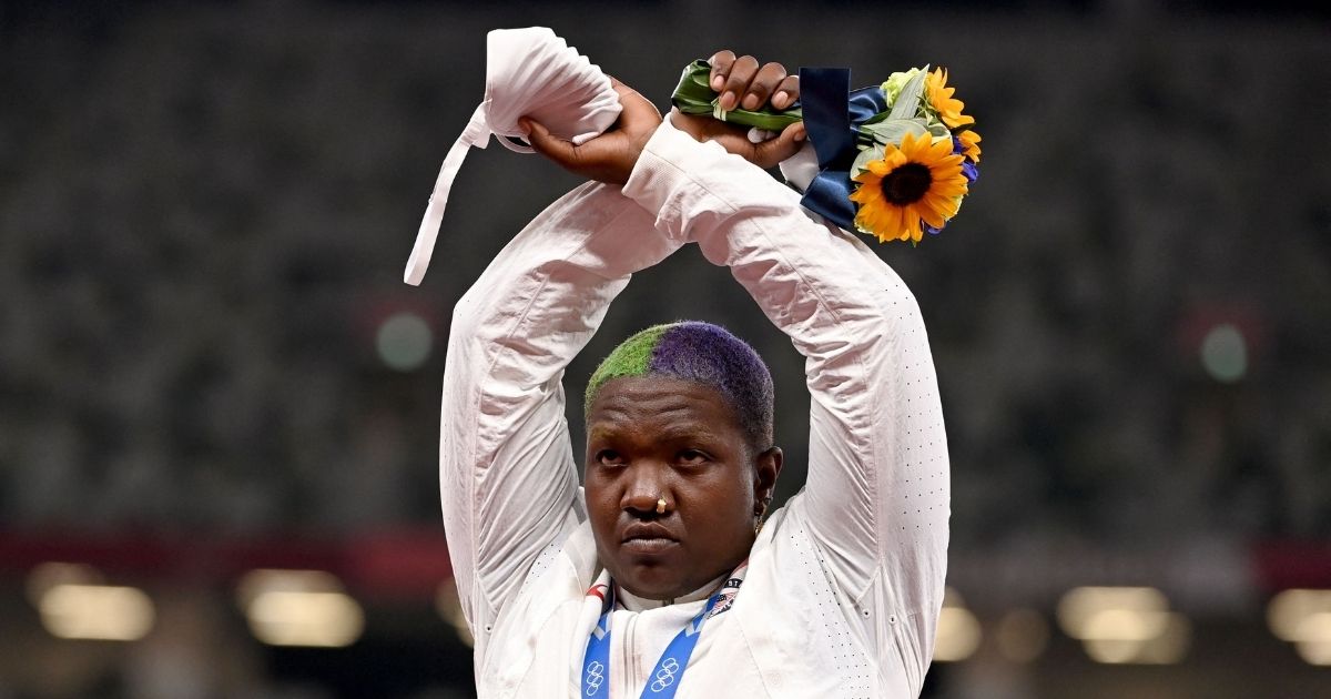 U.S. Olympian Raven Saunders crosses her arms in protest on the podium after winning a silver medal in the women's shot during the Summer Games at the Olympic Stadium in Tokyo on Sunday.