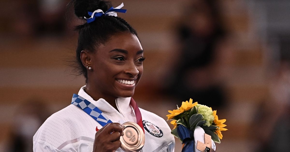 U.S. gymnast Simone Biles poses with her bronze medal during the podium ceremony of the balance beam competition of the Tokyo Olympic Games at the Ariake Gymnastics Centre on Tuesday.