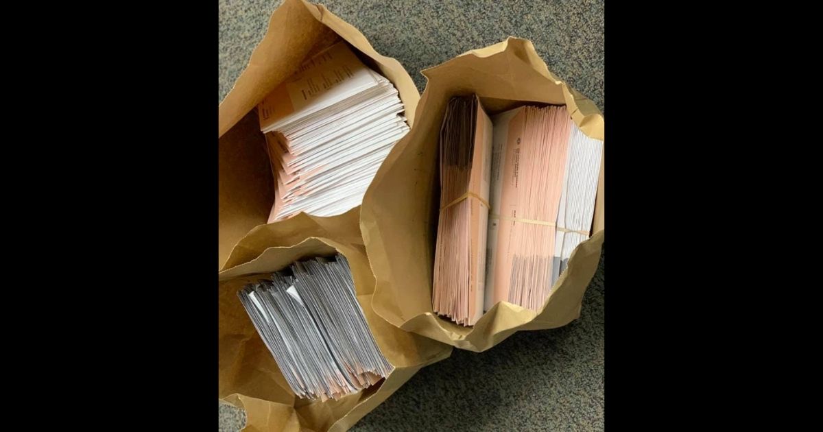 Ballots for the Sept. 14 recall election of California Gov. Gavin Newsom are photographed by police after they were found in a convicted felon's car.