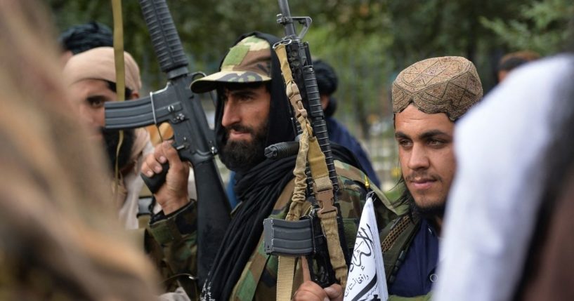 Taliban fighters gather along a street during a rally in Kabul, Afghanistan, on Tuesday.