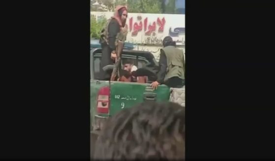 A video obtained by Fox News shows Taliban fighters in the back of a pickup truck kicking a man in the head in Kabul, Afghanistan.