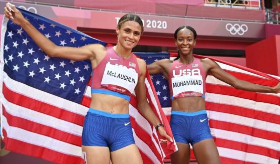 First-placed U.S.A.'s Sydney Mclaughlin, left, and second-placed U.S.A.'s Dalilah Muhammad celebrate after competing in the women's 400m hurdles final during the Tokyo 2020 Olympic Games at the Olympic Stadium in Tokyo on Aug. 4, 2021.