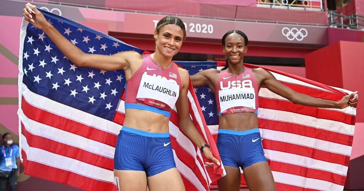 First-placed U.S.A.'s Sydney Mclaughlin, left, and second-placed U.S.A.'s Dalilah Muhammad celebrate after competing in the women's 400m hurdles final during the Tokyo 2020 Olympic Games at the Olympic Stadium in Tokyo on Aug. 4, 2021.