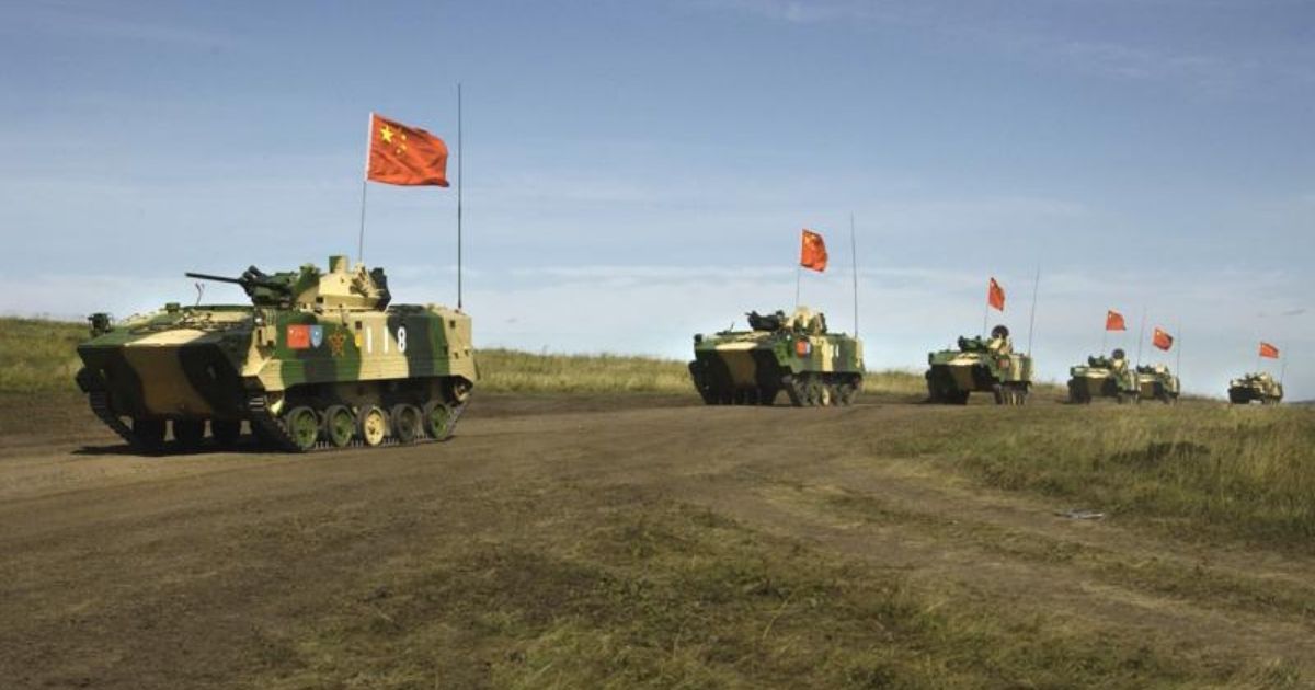 A photo taken on Aug. 13, 2007, shows a convoy of Chinese APCs performing military exercises in the Chelyabinsk region in Russia's Ural Mountains.