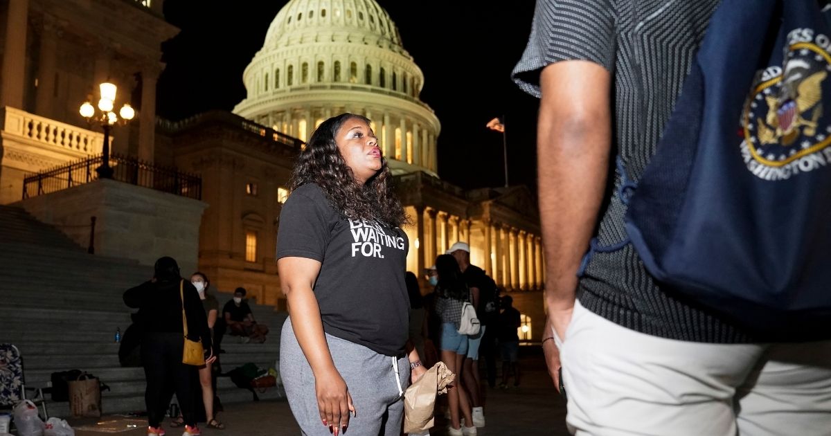 U.S. Rep. Cori Bush, a Democrat from Missouri, speaks with supporters outside the U.S. Capitol on July 31, 2021. Bush is calling for an extension of the federal eviction moratorium.