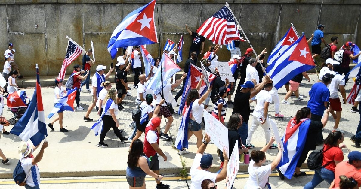 Protesters march on the Cuban Embassy in Washington on July 26 to show support for demonstrations in Cuba that have rocked the island's communist regime.