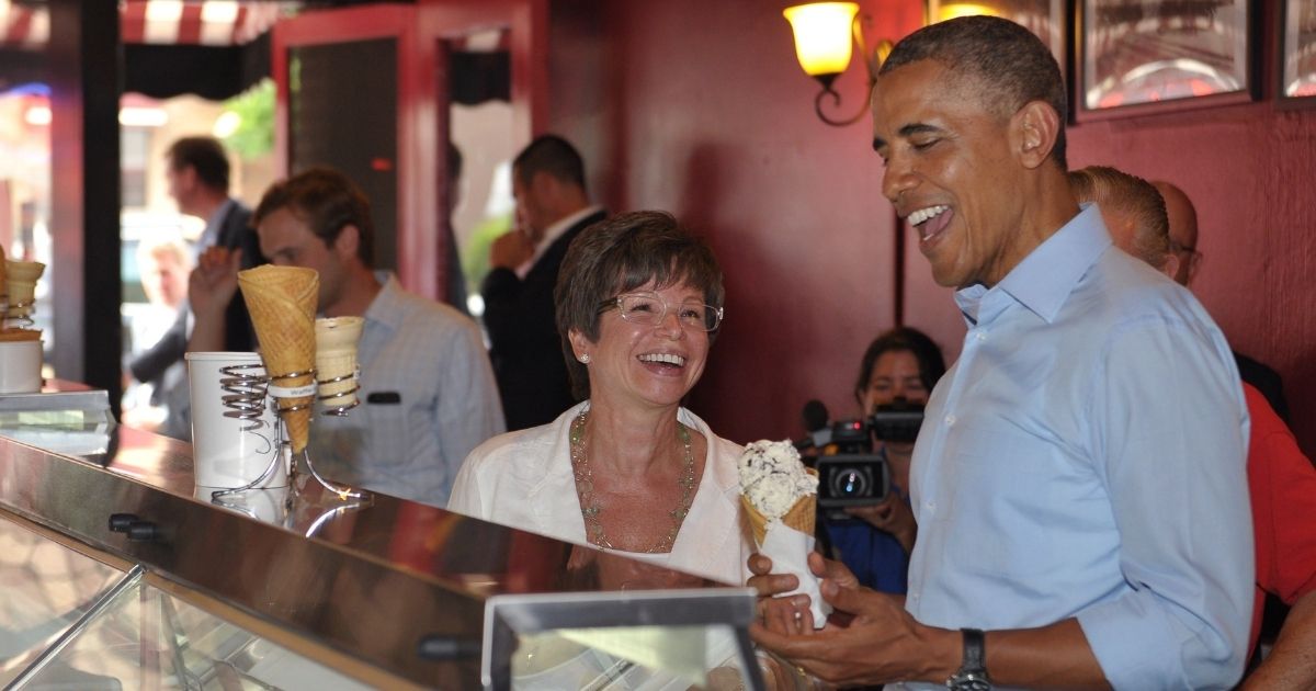 Then-President Barack Obama shares a laugh with longtime adviser Valerie Jarrett in a June 2014 file photo.