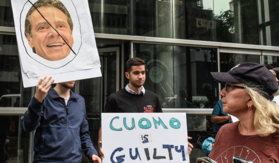 People protest against New York Gov. Andrew Cuomo on Aug. 4, 2021, in New York City. An investigation by the state's attorney general, Letitia James, has concluded that Cuomo sexually harassed multiple women.
