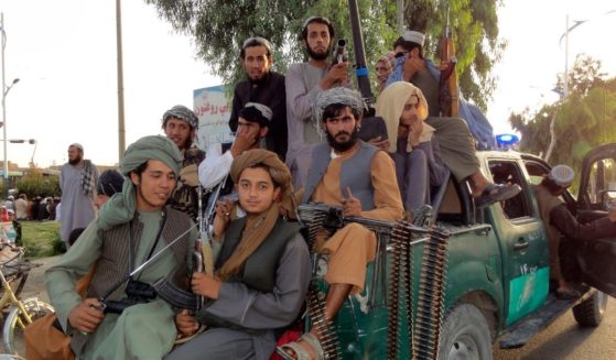 Taliban fighters patrol inside the city of Kandahar, Afghanistan, on Sunday.