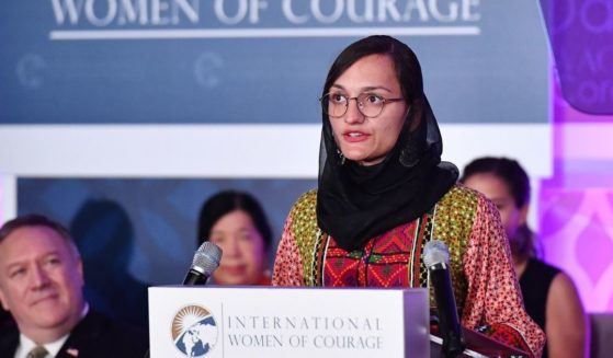 Zarifa Ghafari, the first female mayor in Afghanistan, is pictured accepting an International Women of Courage Award from in March 2020, chosen by then-Secretary of State Mike Pompeo, left.