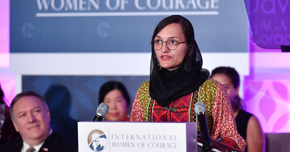 Zarifa Ghafari, the first female mayor in Afghanistan, is pictured accepting an International Women of Courage Award from in March 2020, chosen by then-Secretary of State Mike Pompeo, left.