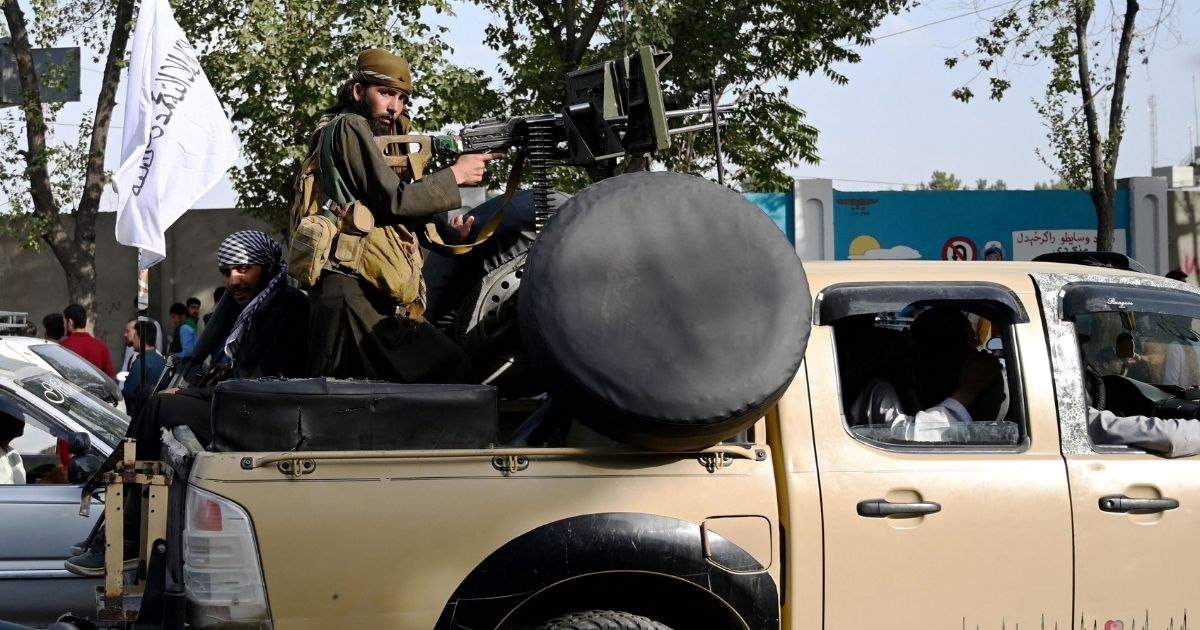 Taliban fighters patrol Kabul on Thursday.