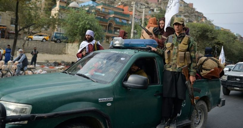Taliban fighters on a pick-up truck ride in a rally in Kabul on Tuesday, celebrating the U.S. military withdrawal from the country.