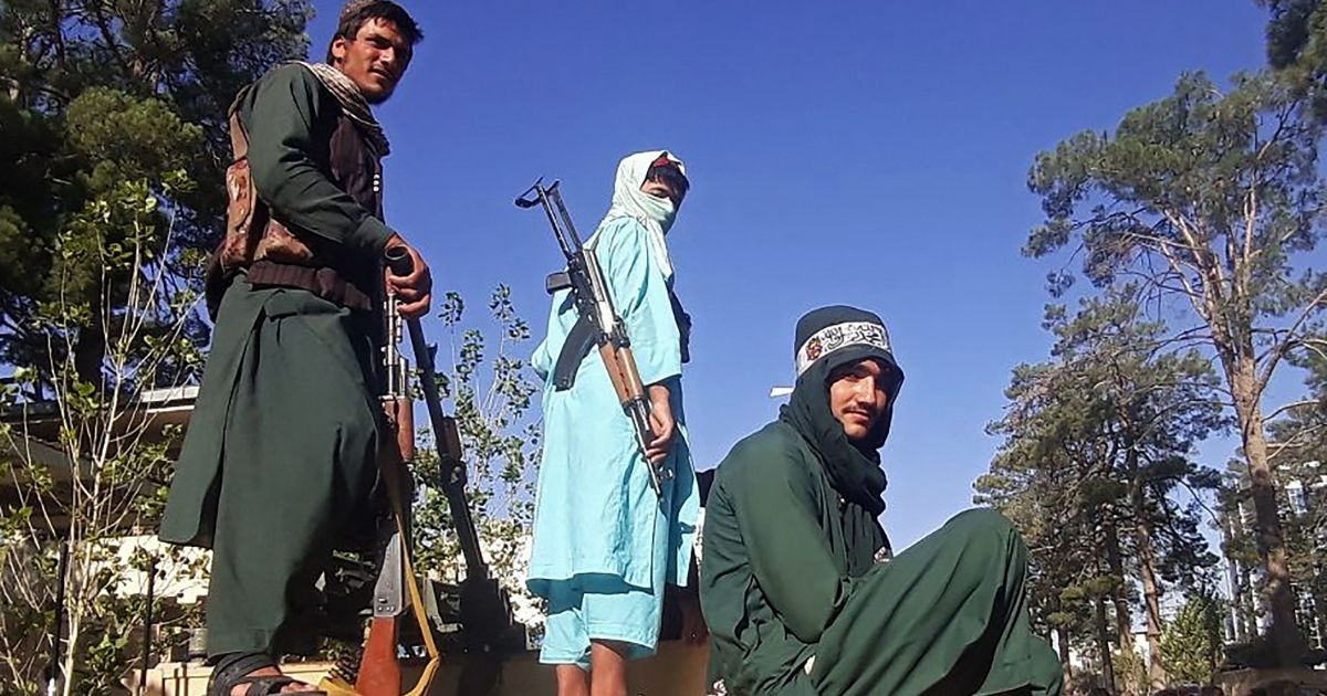 Taliban fighters are seen standing in Herat, Afghanistan, in a photo taken on Friday.
