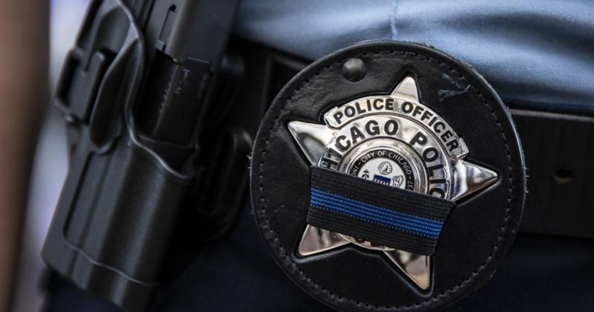 A photo taken on Tuesday shows a police officer’s badge as the cop wearing it walks into the Leighton Criminal Courthouse in Chicago.