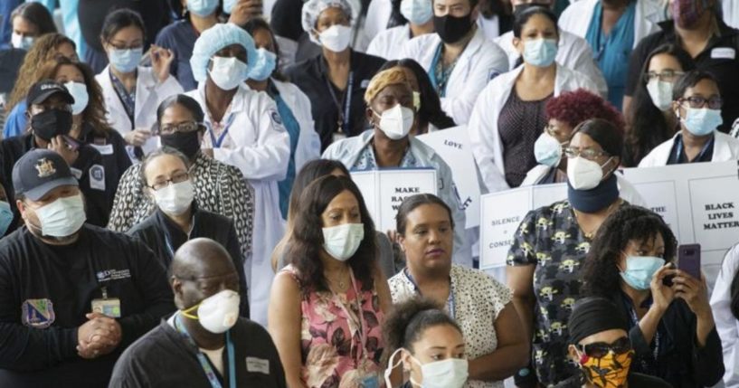 Health care workers at the Kings County Hospital in Brooklyn, New York, are seen standing together on June 4, 2020.
