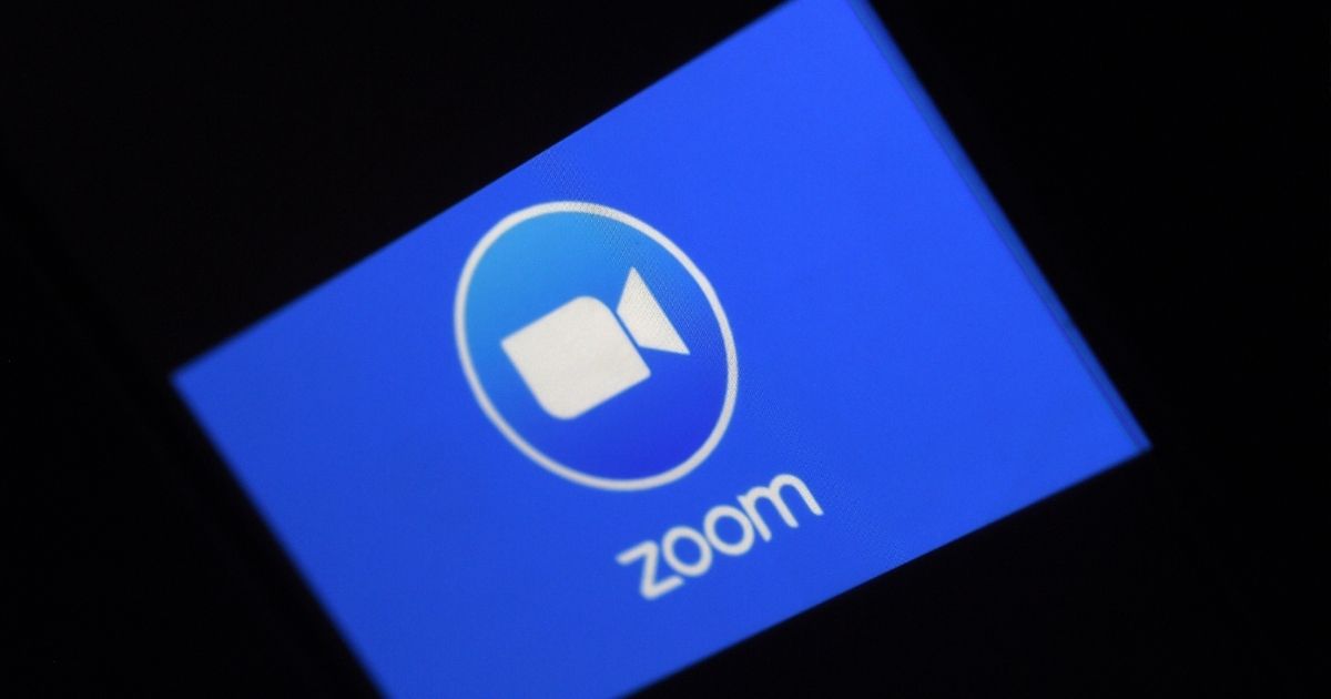 The Zoom logo is depicted in a photo taken on March 30, 2020, in Arlington, Virginia.