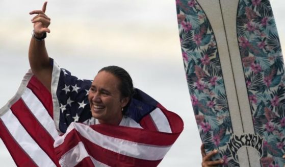 Surfer Carissa Moore celebrates during the Summer Olympics at Tsurigasaki in Ichinomiya, Japan, on July 27.