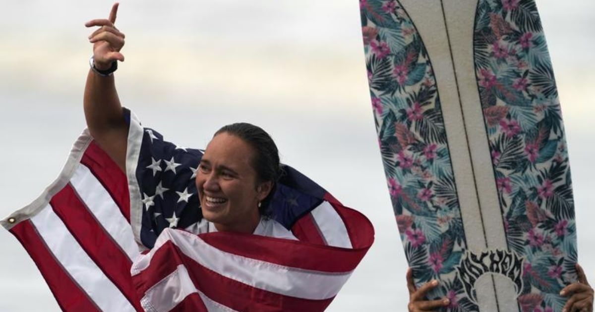 Surfer Carissa Moore celebrates during the Summer Olympics at Tsurigasaki in Ichinomiya, Japan, on July 27.