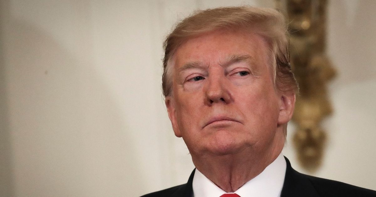 Then-President Donald Trump looks on during an event recognizing the Wounded Warrior Project Soldier Ride in the East Room of the White House, April 18, 2019, in Washington, D.C.