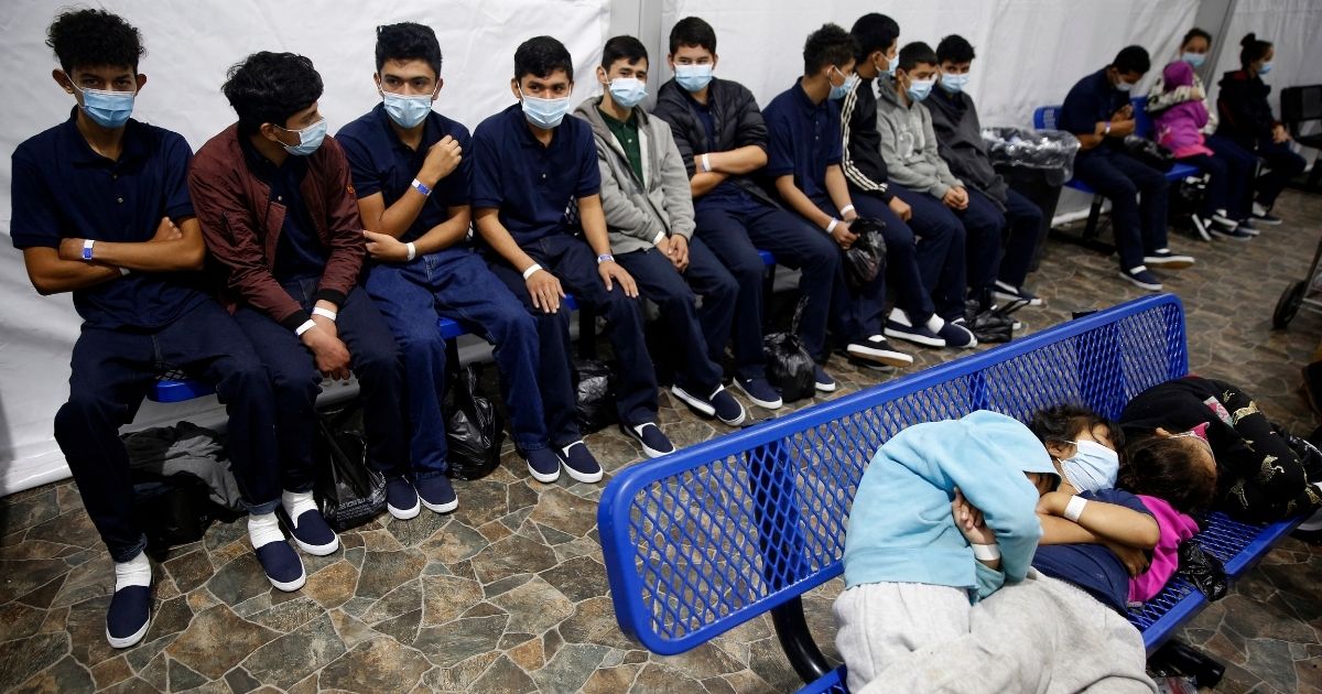 Young unaccompanied migrants wait for their turn at the secondary processing station inside the Donna Department of Homeland Security holding facility, the main detention center for unaccompanied children in the Rio Grande Valley, in Donna, Texas, on March 30, 2021.
