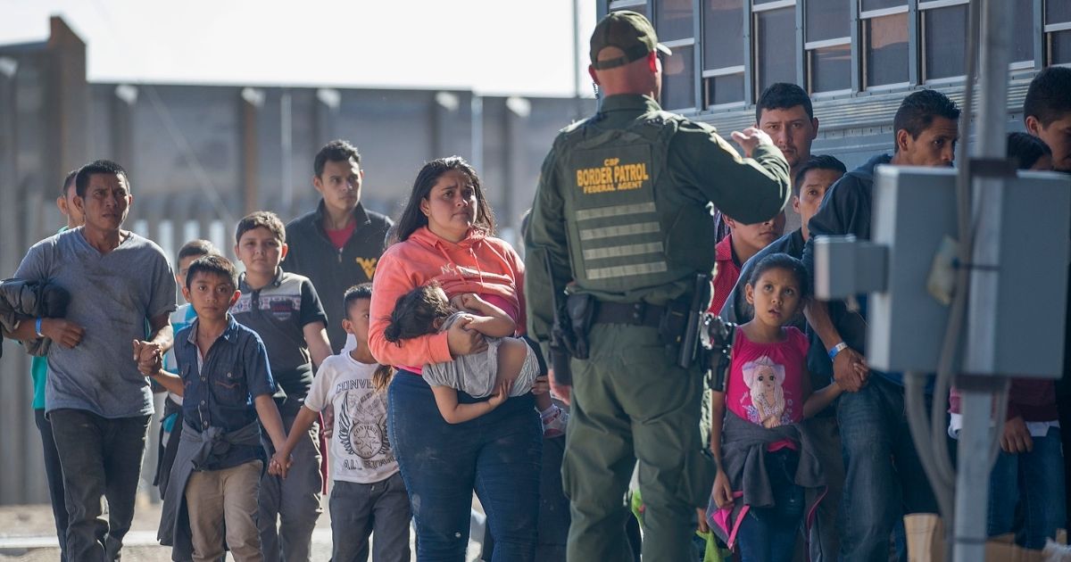 Migrants are loaded onto a bus by U.S. Border Patrol agents after being detained when they crossed into the United States from Mexico on June 01, 2019, in El Paso, Texas.